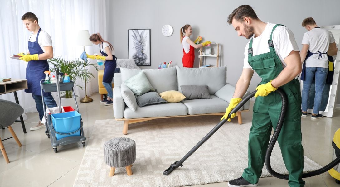 8 Group of cleaners, cleaning a living room