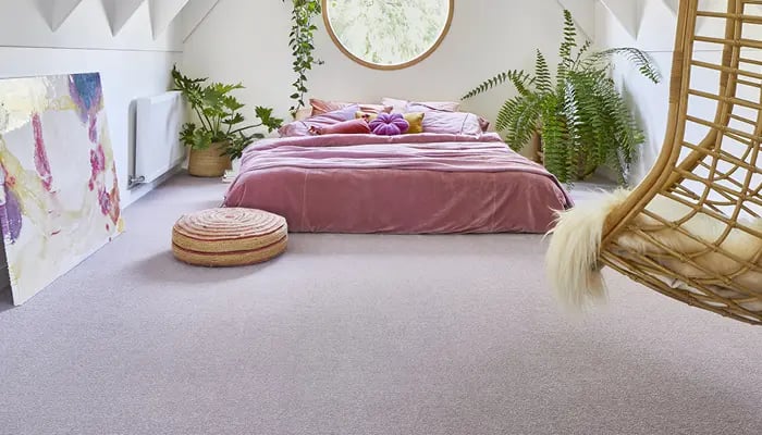 Bedroom in attic with Pink bed and Carpet